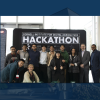 Credit: Abigail Younger - A color photo showing Members of "The Freshmen," the grand challenge winners at the hackathon, stand with judges, deans and mentors.