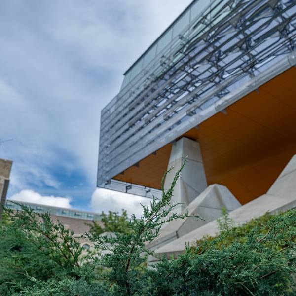 A color photo showing the exterior of Gates Hall 